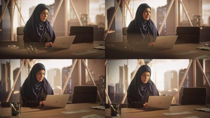 阿拉伯执行经理，在笔记本电脑上的业务研发办公室工作。中东女性回顾企业增长战略并与合作伙伴沟通