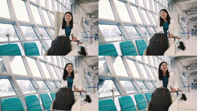 亚洲妇女独自在机场候机室旅行。