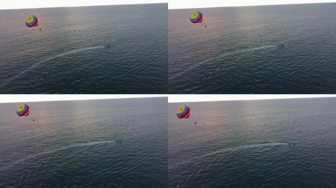 在海洋中漂浮的降落伞中附着在人身上的渔船