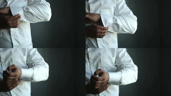 男人穿着白衬衫和袖扣