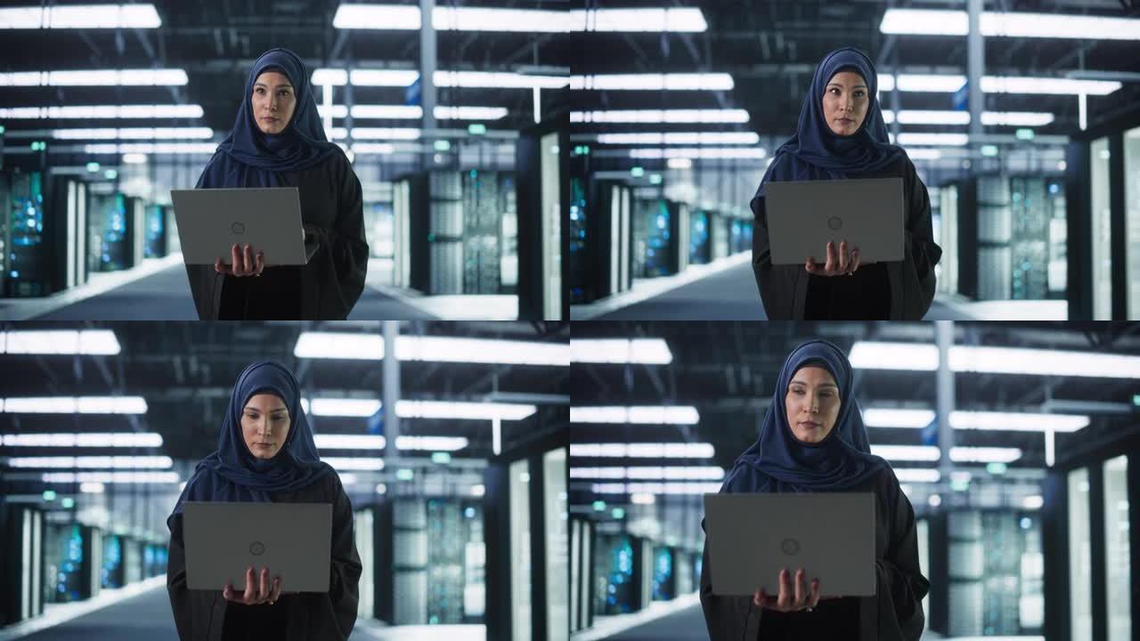 一位年轻的中东女性IT系统工程师的肖像穿着传统的头巾，在现代技术服务器设施中使用笔记本电脑。工作中的