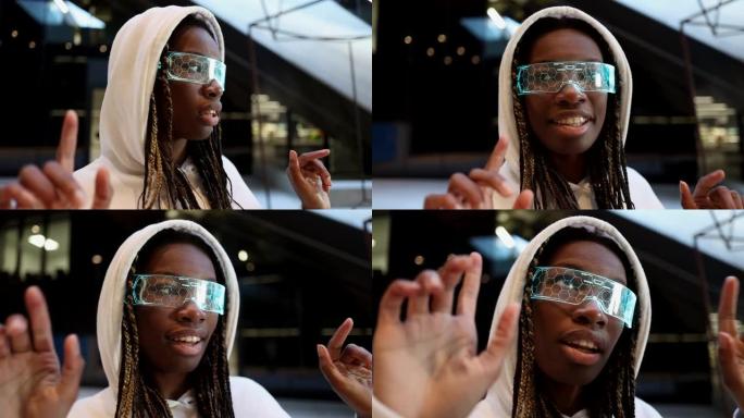非洲妇女戴着未来派虚拟现实护目镜，陷入了一个无限的可能性和无限的创造力的世界。