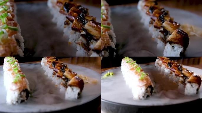 别致的非常漂亮的寿司配金枪鱼和鳗鱼配干冰美味的开胃广告加州寿司吧寿司套装餐厅棕榈叶棒供应令人难以置信