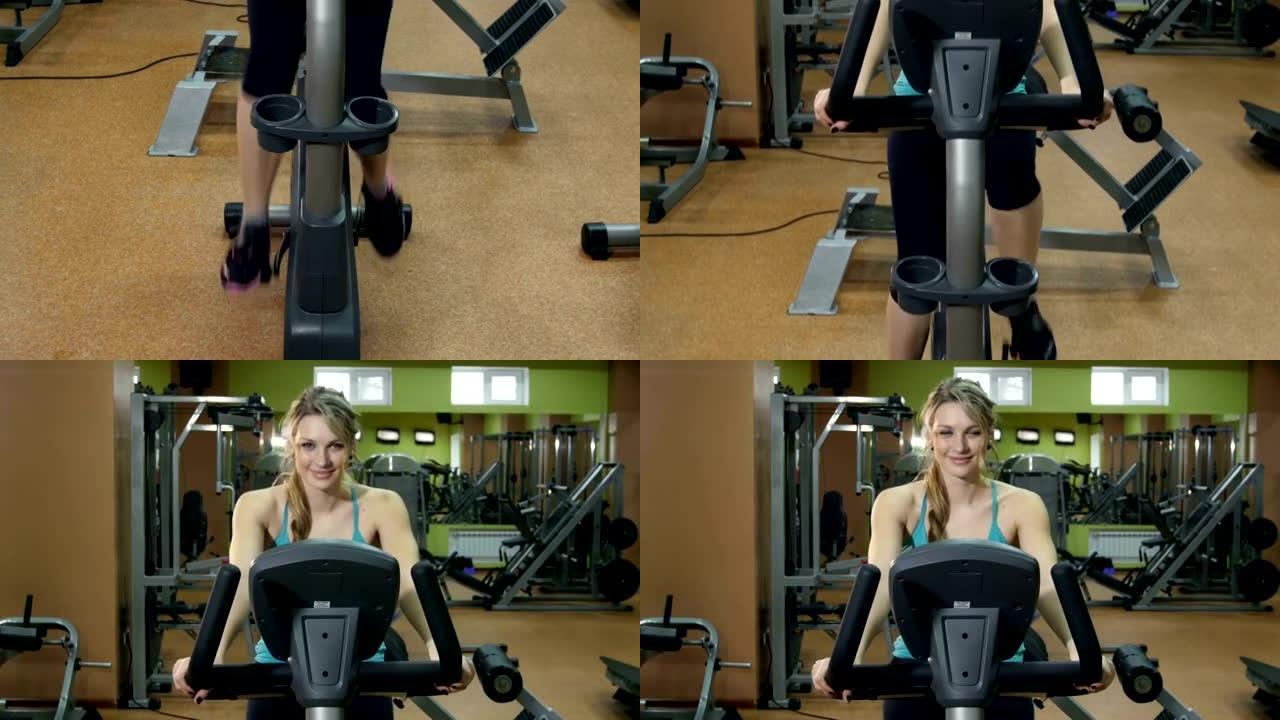 运动女孩在健身馆骑自行车，凸轮向上移动，慢动作
