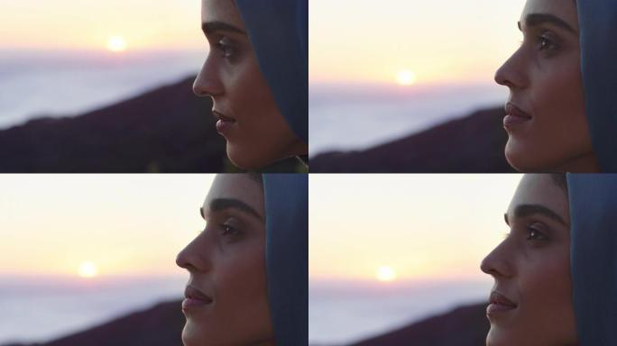 美丽的穆斯林妇女的特写肖像看起来沉思探索灵性感觉平静享受日落戴着头巾