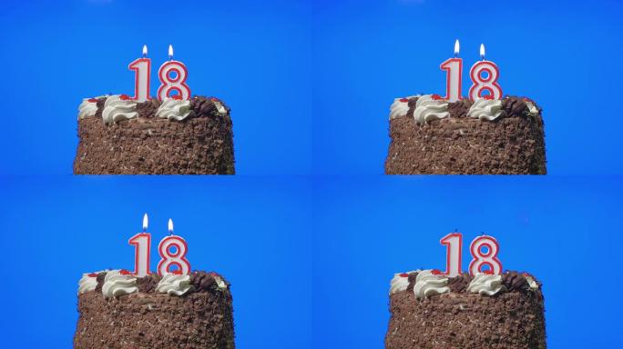 在美味的巧克力蛋糕上吹出18号生日蜡烛，蓝屏