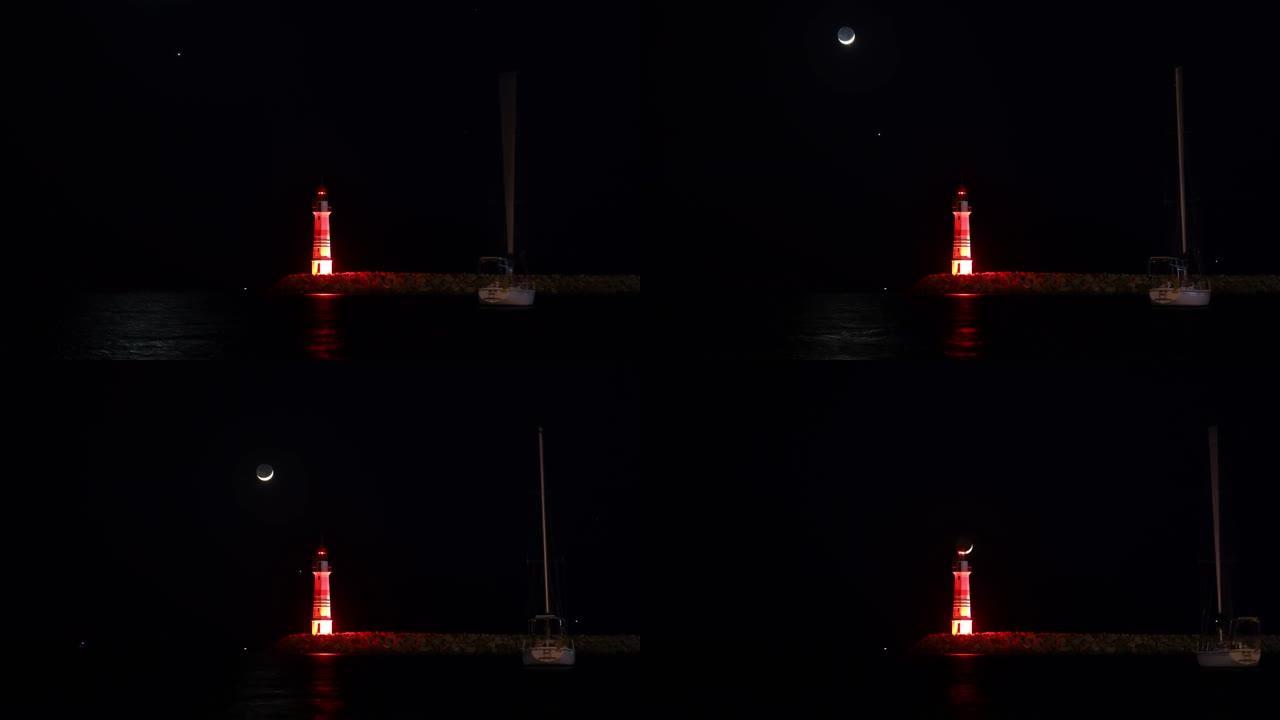 金星首先在红色灯塔上方落下，然后是月亮。新月穿过灯笼的中心。大海中一艘帆船的延时图像。