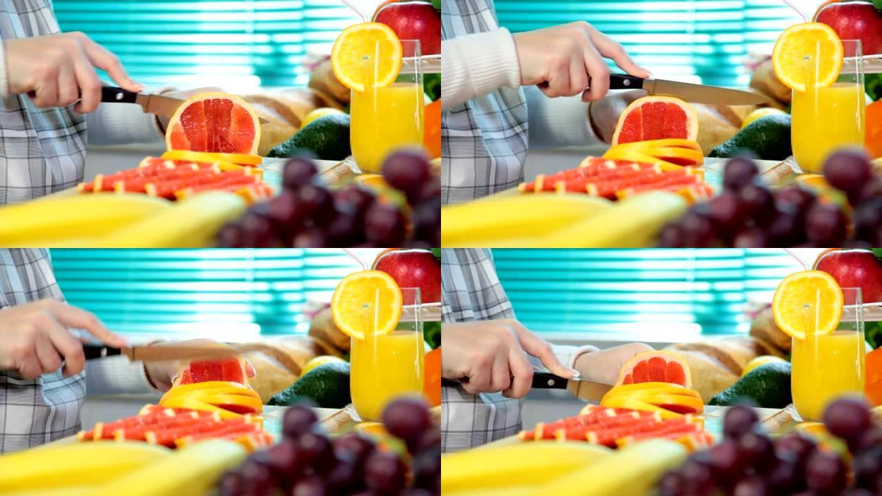 女人手切葡萄柚