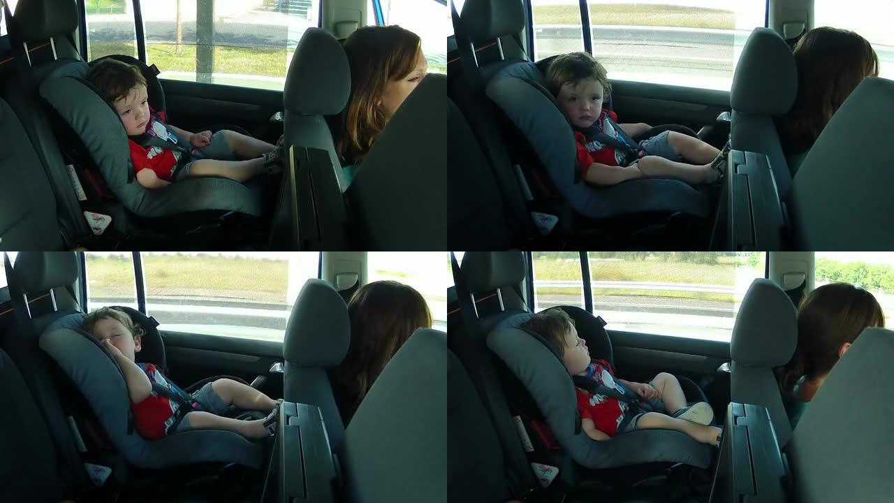蹒跚学步的孩子在汽车旅行中入睡