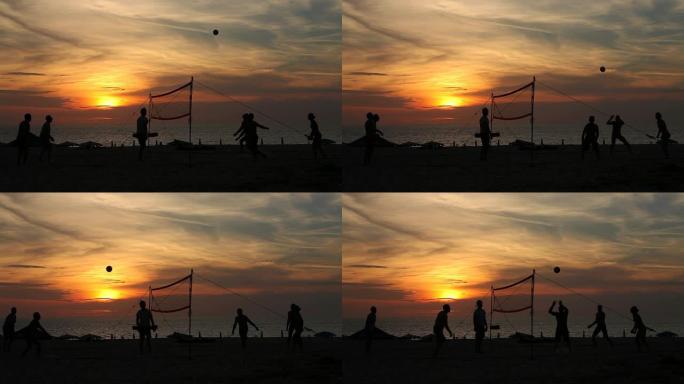 泰国。普吉岛。卡伦海滩。打排球的人的剪影