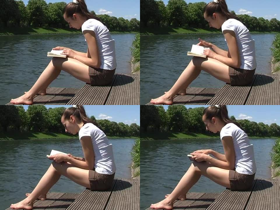 在河边读书的女孩