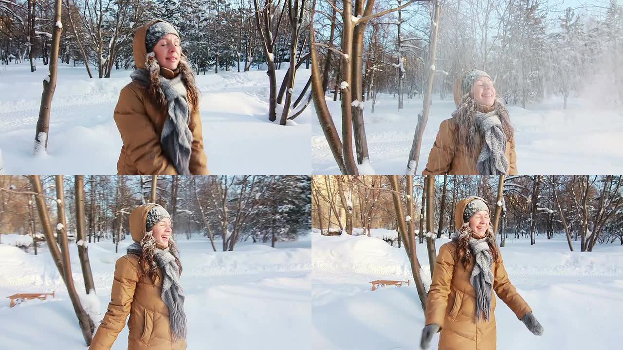 公园里的女孩很高兴扔雪