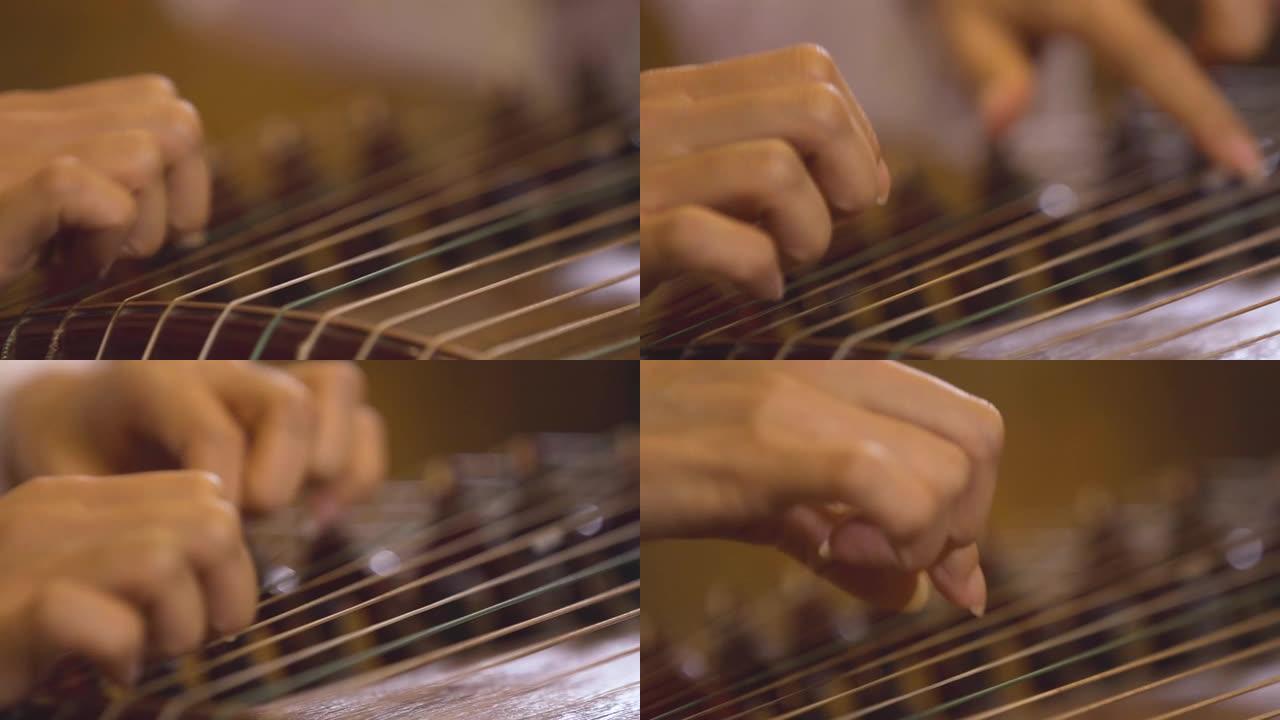 亚洲女人用手指弹奏竖琴演奏音乐