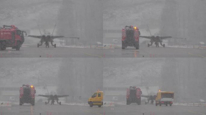 紧急情况后，战斗机缓慢返回机库，随后是消防车