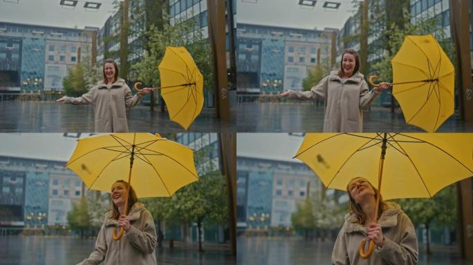 SLO MO年轻女子带黄色雨伞享受雨水