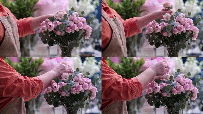 花店设计可爱的布置粉红玫瑰与精确和护理，花卉装饰专业