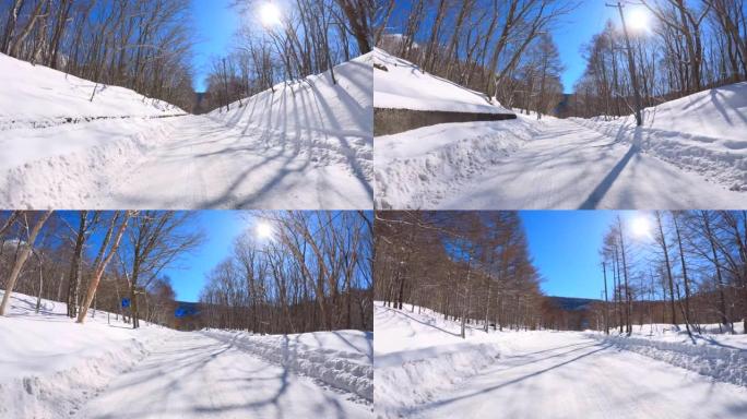 冬季在多雪山区的森林道路上行驶