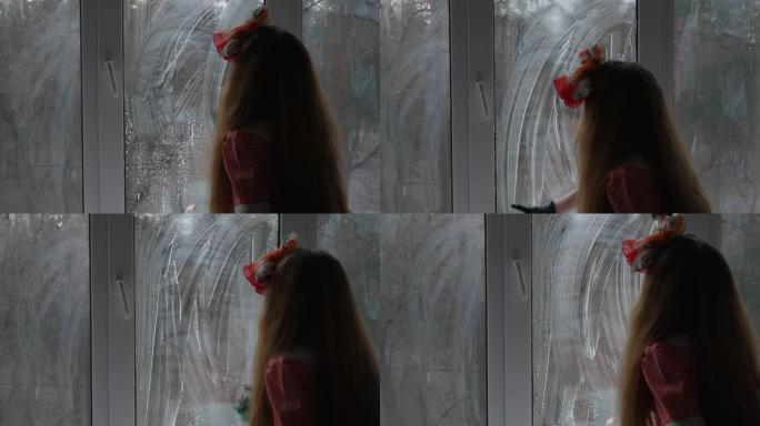 特写，女孩洗窗户。双层玻璃窗的清洁。