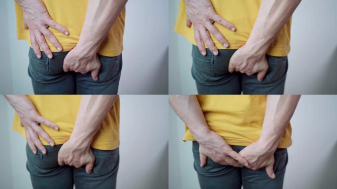 一个中年男子的4k视频镜头有臀部疼痛，痔疮，肛门疾病。