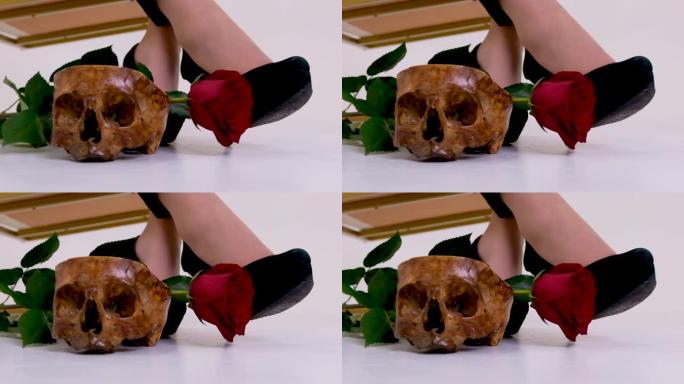特写骷髅鞋和一朵玫瑰慢慢落下砸在地板上跳跃的女人坐着冷静不动的空间为文字失去了感情失去了爱情生死不速