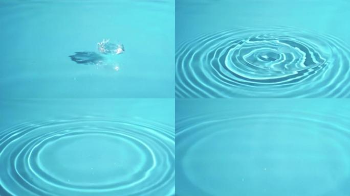 晴天游泳池里一滴水水环的特写视频