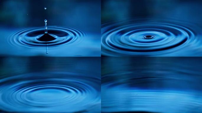 水滴掉落并在蓝色水面上产生涟漪