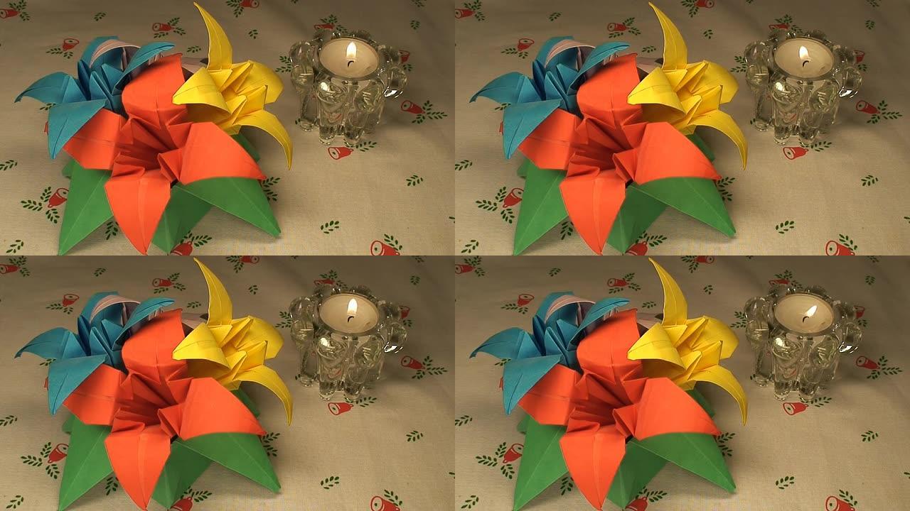 圣诞桌布上的纸郁金香和蜡烛 (HD 1080/60i)