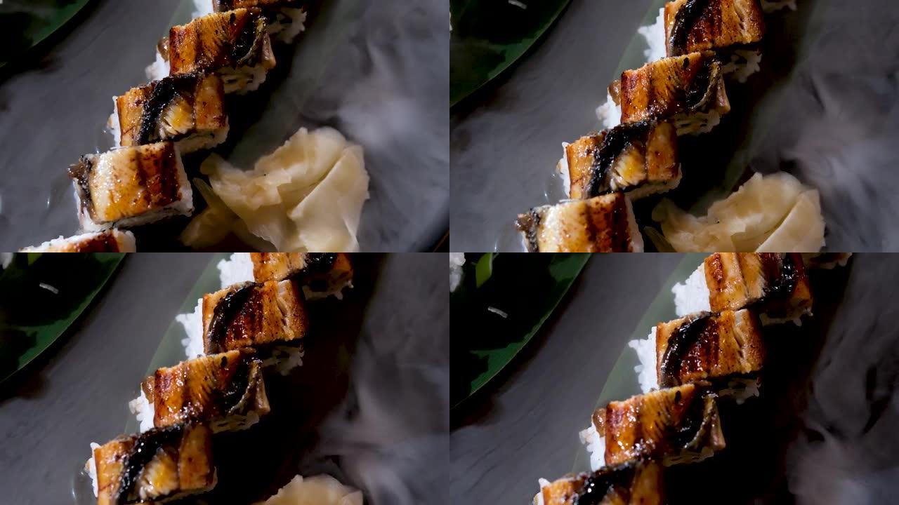 别致的非常漂亮的寿司配金枪鱼和鳗鱼配干冰美味的开胃广告加州寿司吧寿司套装餐厅棕榈叶棒供应令人难以置信