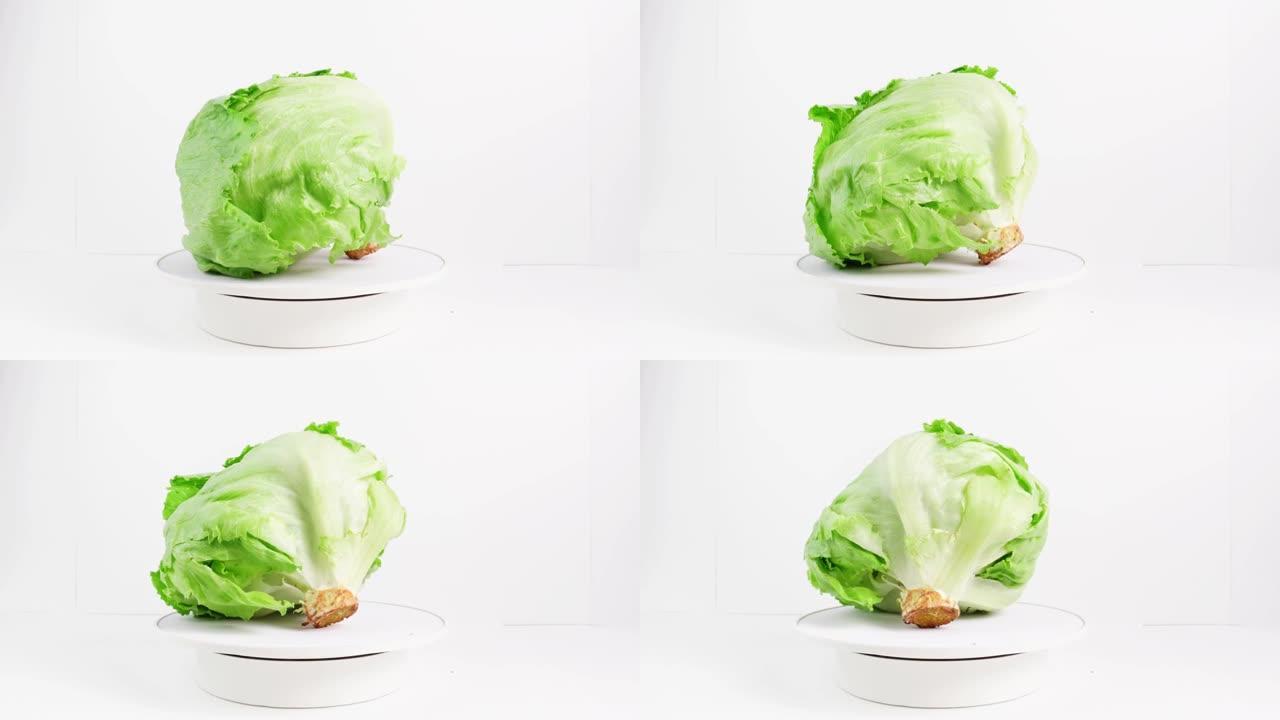 卷心莴苣绿色沙拉打开白色背景。旋转360度
