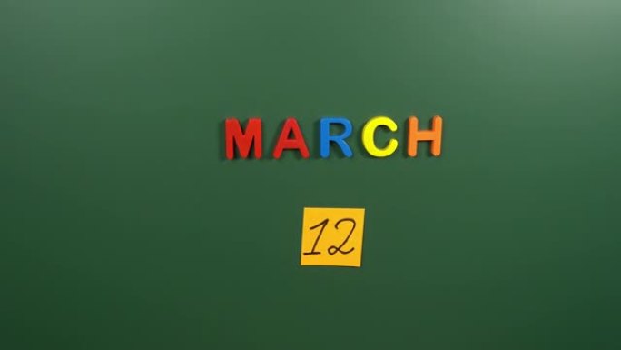 3月12日日历日在学校董事会上手工粘贴贴纸。3月12日。三月的第十二天。第12个日期编号。12天日历