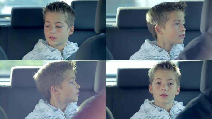 从后座开车时的小男孩正环顾汽车