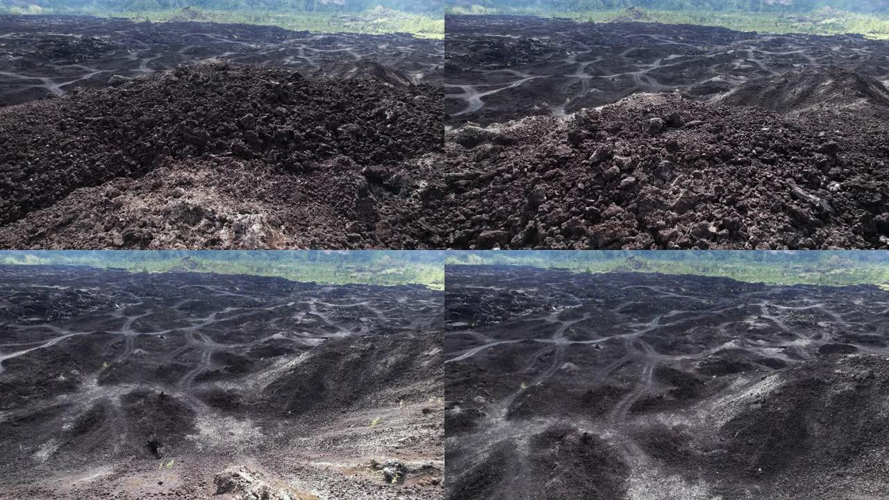 黑色破碎的熟料堆和硬化的熔岩场，鸟瞰图