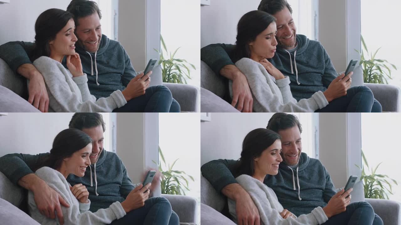 幸福的夫妇使用智能手机进行视频聊天，婴儿喜欢在手机上与家人聊天