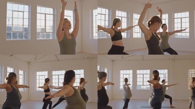 瑜伽课教练教孕妇锻炼健康的生活方式练习战士在日出时在工作室享受团体体能锻炼