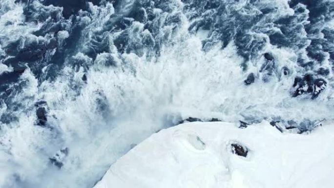瀑布冬季边缘飞越风景史诗空中飞行冰岛著名瀑布周围的雪冰水流过高崖灵感史诗尺度自然冒险