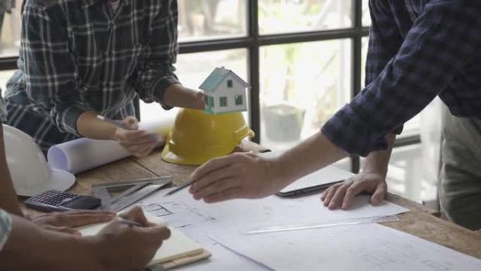 与咨询工程师和工作计划会面建筑师或工程师设计房屋，修改图纸，创建建筑项目并增加客户的需求。