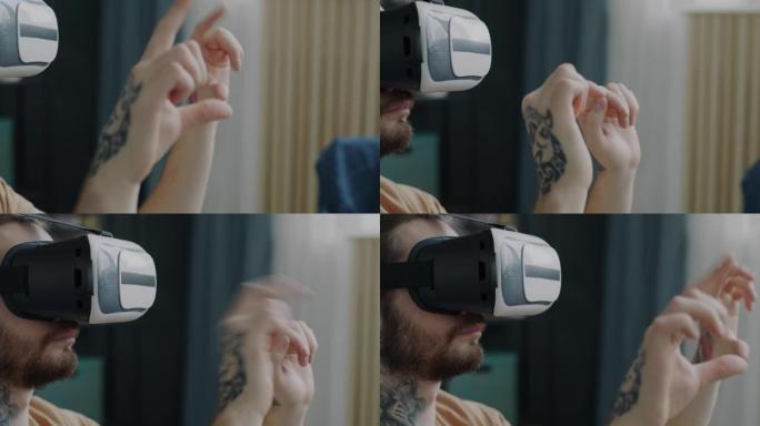 戴虚拟现实眼镜的家伙用纹身移动手在家享受酷小玩意