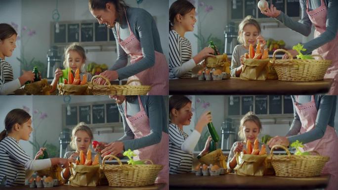 一个女人和她的两个女儿午餐选择蔬菜的肖像。可爱的小女孩在厨房里帮助妈妈，准备一起做一顿美味的饭