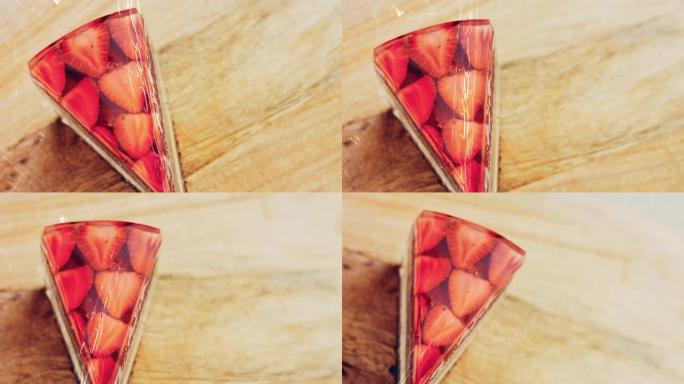 草莓和果冻蛋糕切片的轮廓效果。微距和滑块拍摄。背景是复古的气氛