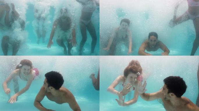 朋友跳进游泳池水下玩得开心一起庆祝暑假一群青少年享受泳池派对春假庆祝4k