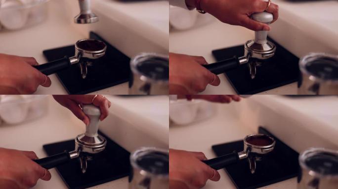 手，咖啡压榨机和浓缩咖啡过滤器开始早晨在家庭，厨房或咖啡馆中获得能量。女人，在咖啡师工作、餐馆或小企