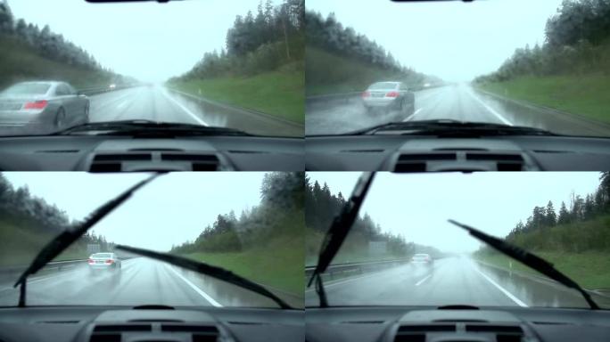 在多雨的高速公路上行驶，汽车慢速超车