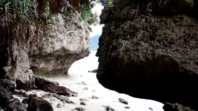 琉球群岛石灰岩洞穴外的动作镜头。