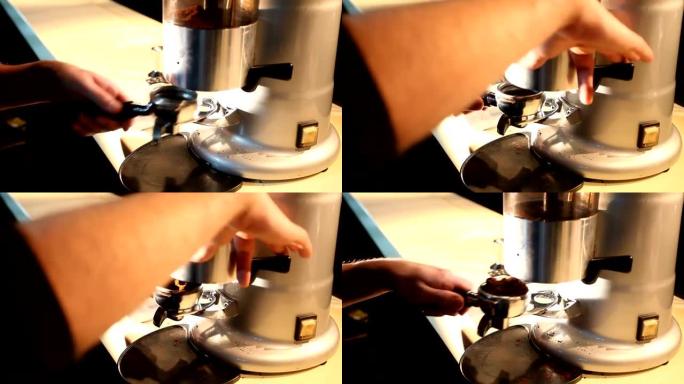 咖啡师从研磨机中获取研磨咖啡