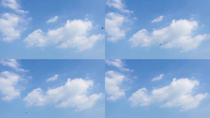 一架直升机穿过蓝天白云