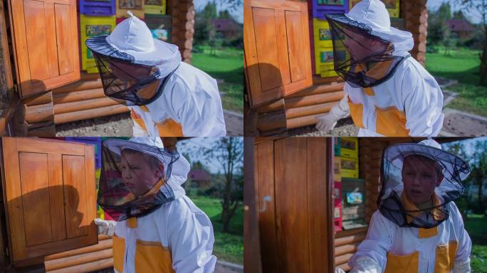 养蜂人检查蜜蜂后，他关上了蜂箱的门