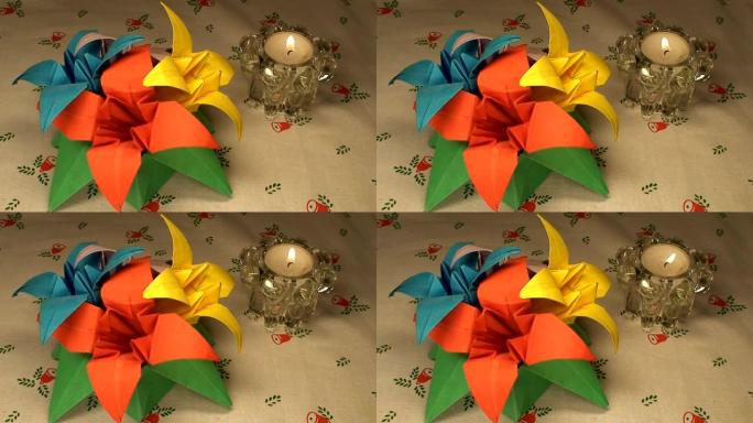 圣诞桌布上的纸郁金香和蜡烛，特写 (HD 1080/50i)