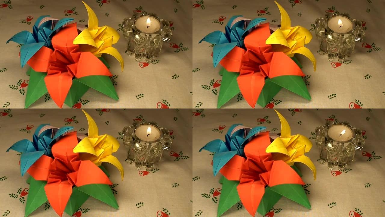 圣诞桌布上的纸郁金香和蜡烛，特写 (HD 1080/50i)