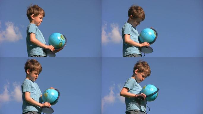 站在天空的男孩旋转地球