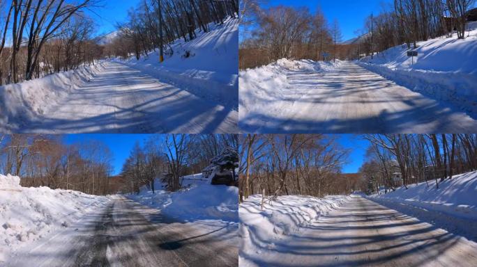 在冬季山区积雪覆盖的道路上行驶